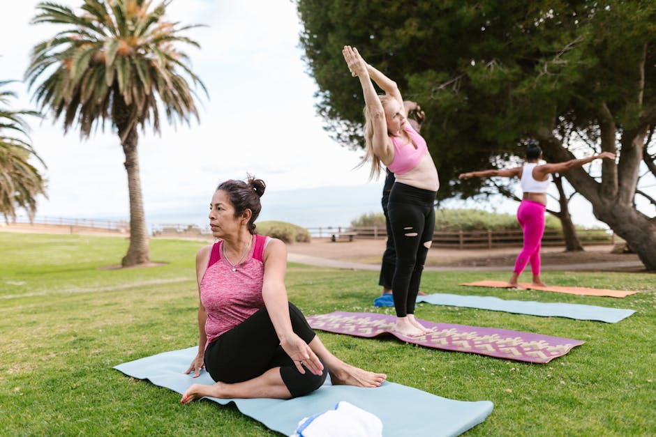group participating in a guided meditation or yoga class outdoors - depression anxiety retreat